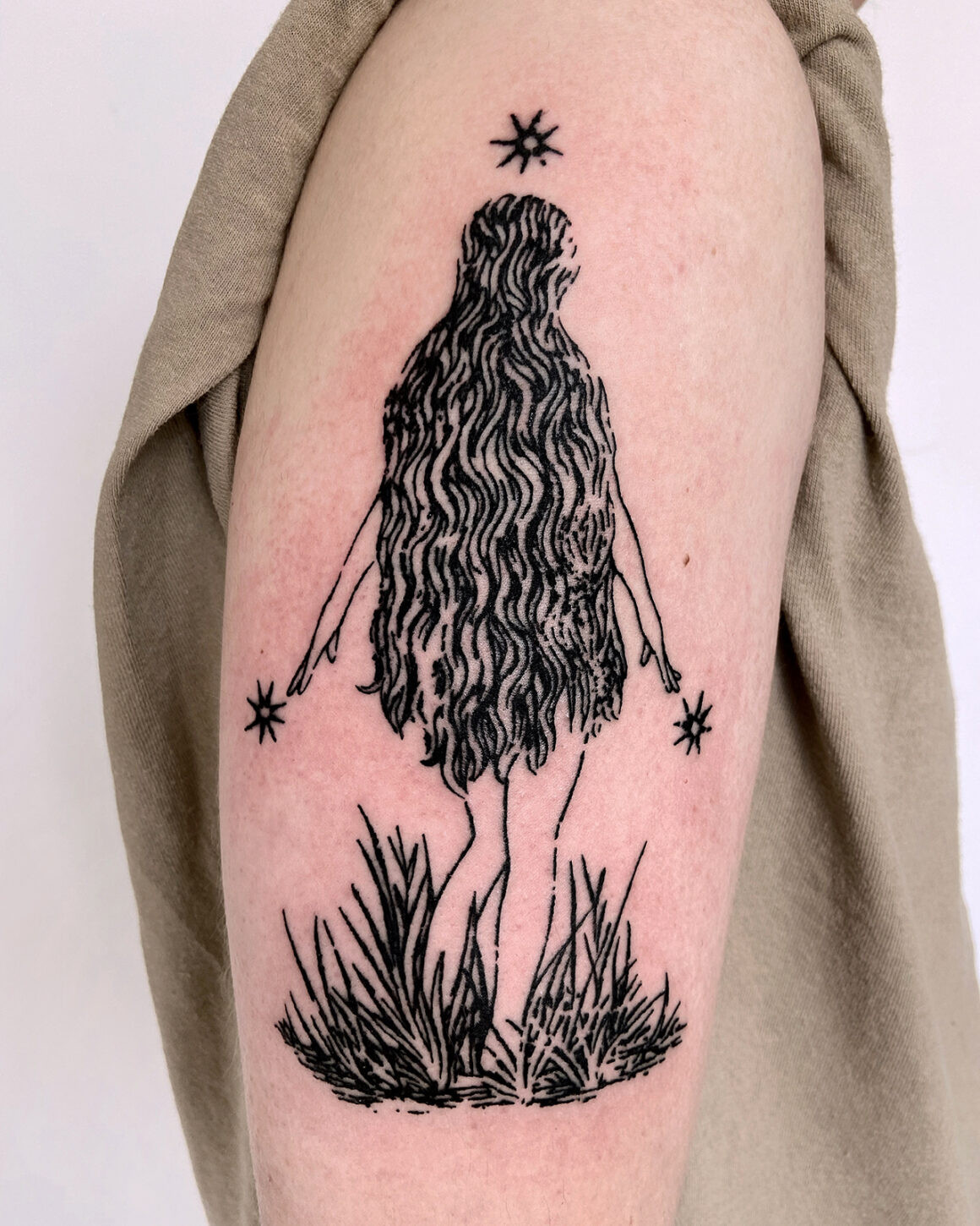 Kelly Rico's tattoo highlighting the raw and handmade feel, embodying the essence of chaos tattoo with its unconventional yet deliberate design.