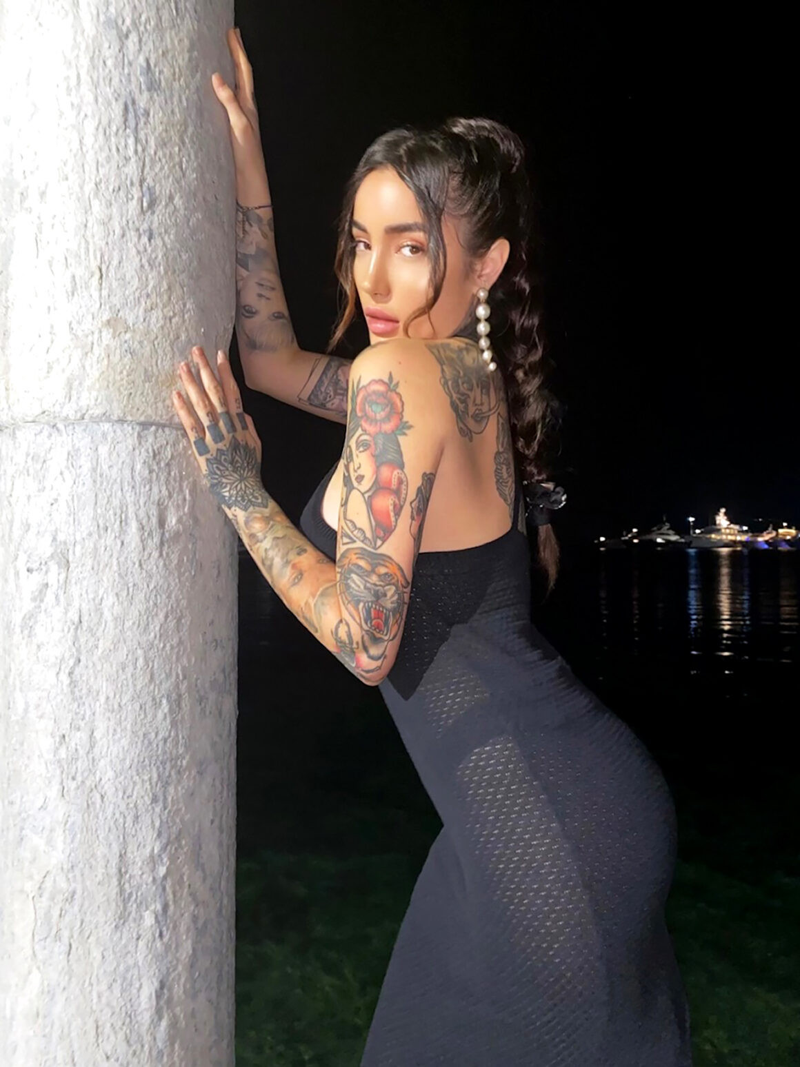 Travel enthusiast and tattoo model Lucrezia in Los Angeles, expressing freedom