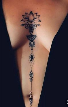 Elegant lotus and geometric design back tattoo with intricate details on a person