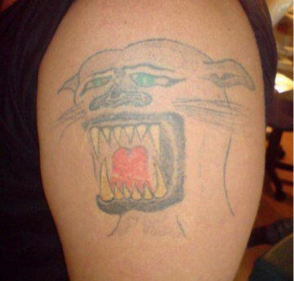 Sucky Panther Tattoo meme, depicting a poorly executed panther tattoo, humorous in nature