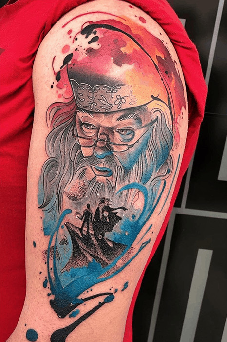 Amazingly colored portrait tattoo of Dumbledore, a tribute to the wise mentor in Harry Potter