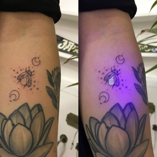 A close-up of a black light tattoo showcasing fine line work, emphasizing the precision required for UV ink application.