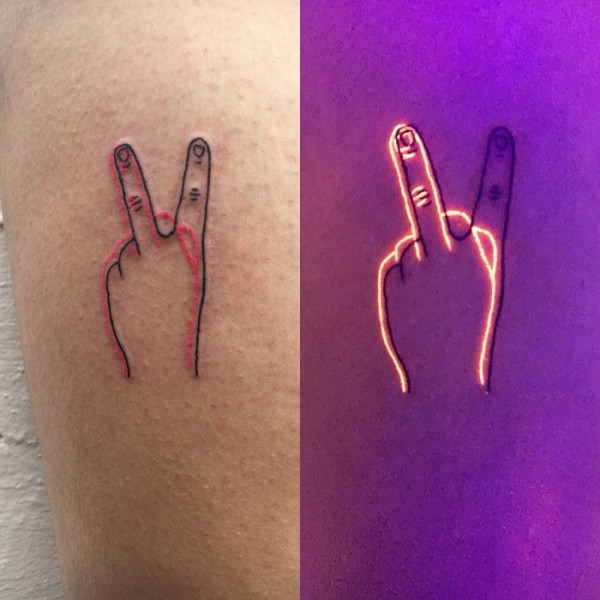 A freshly done black light tattoo with a SecondSkin bandage, demonstrating the initial aftercare steps.