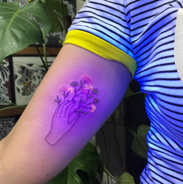 A healed tattoo, potentially showcasing the long-lasting nature of UV ink over time.