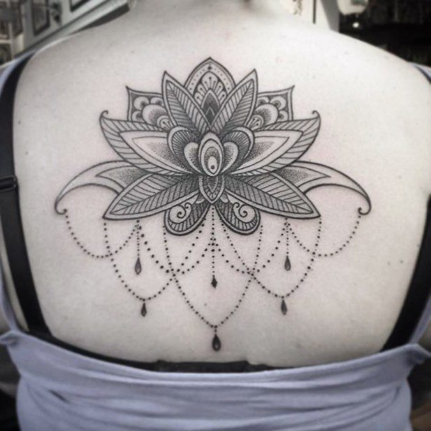 Ornamental lotus tattoo by Ning Chula, a unique take on the lotus, demonstrating its versatility beyond traditional Japanese styles.