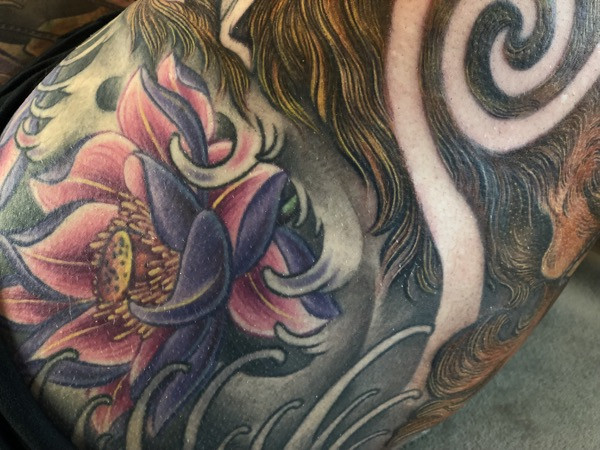 Color progression in the Kitsune tattoo, showcasing the addition of floral hues and enhancing the overall vibrancy