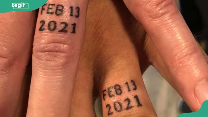 Wedding date ring tattoo as a permanent reminder of a couple's special day of union.