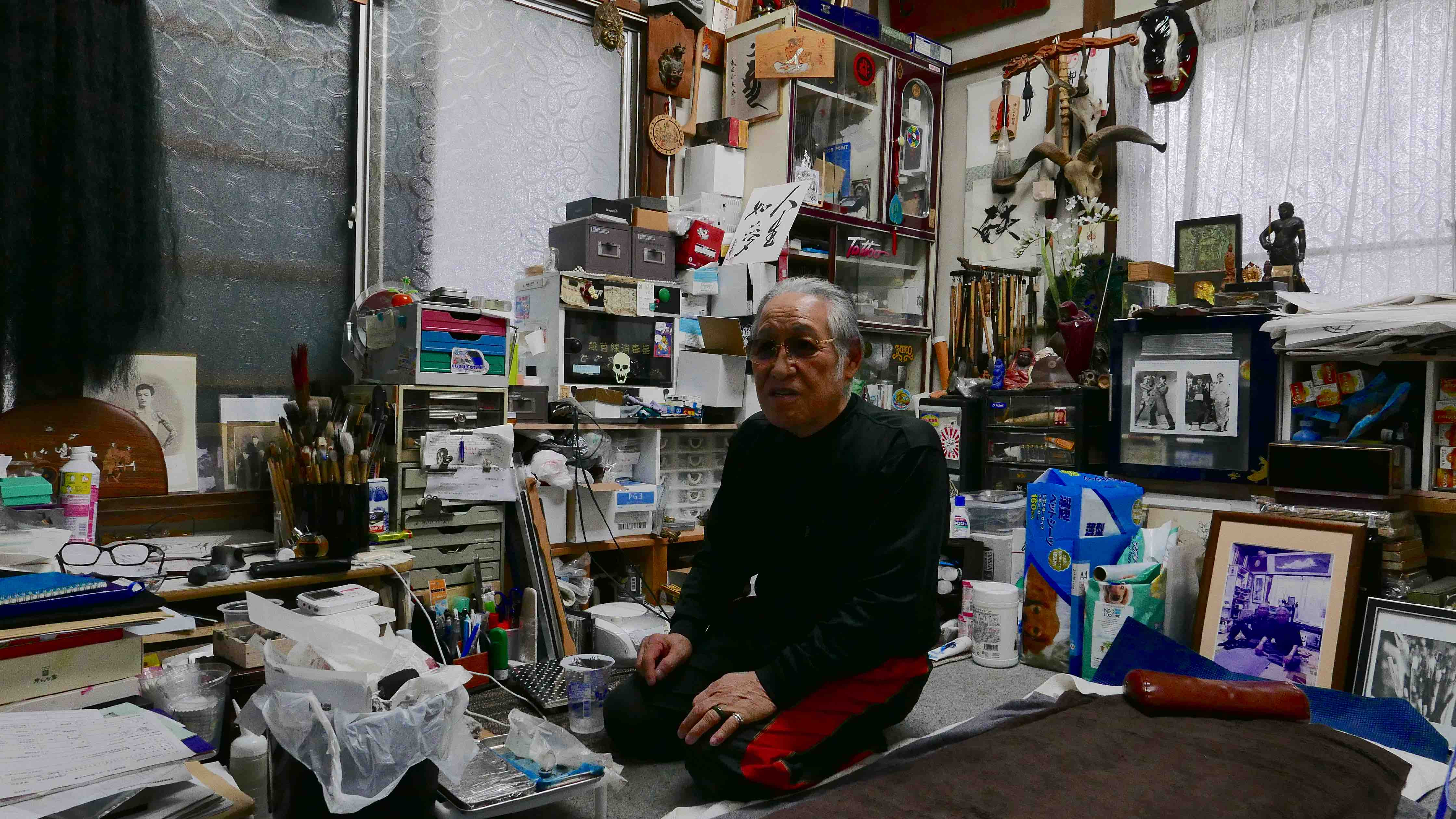 Horiyoshi 3 in his studio, surrounded by his craft