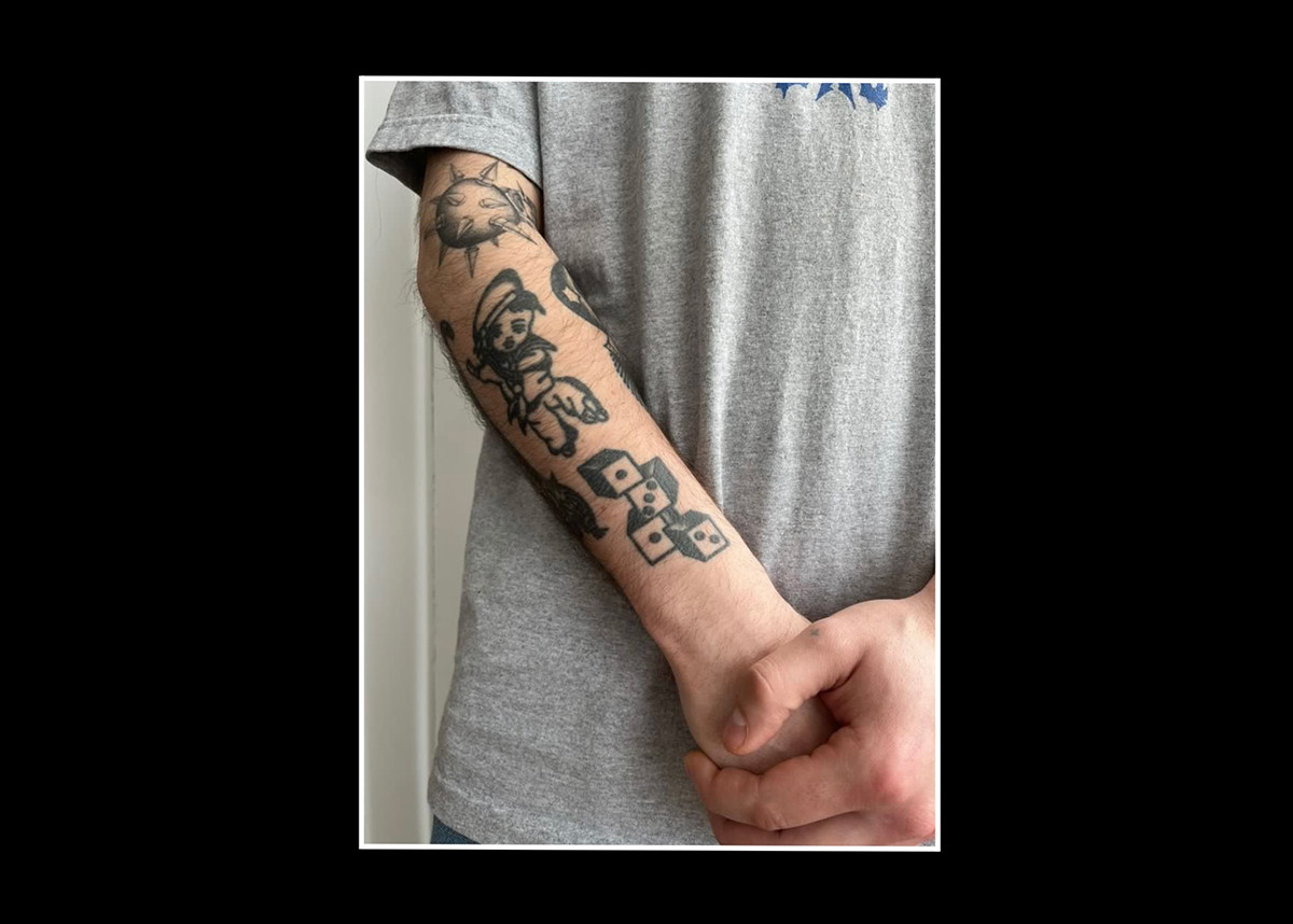 ACAB tattoos – four dice in black ink on someone's arm showing 1312 - dice tattoo meaning acab