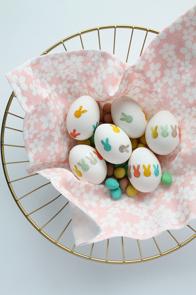 Basket of bunny tattoo Easter eggs, highlighting the festive and decorative appeal of the craft.