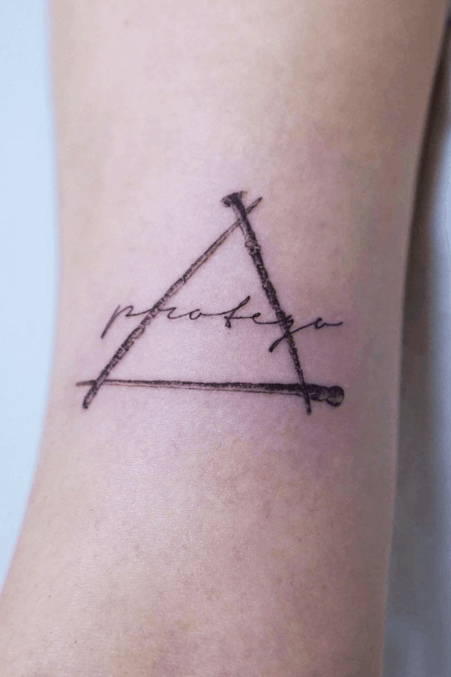 Expecto Patronum spell tattoo with the Deathly Hallows symbol, combining protection magic with iconic imagery