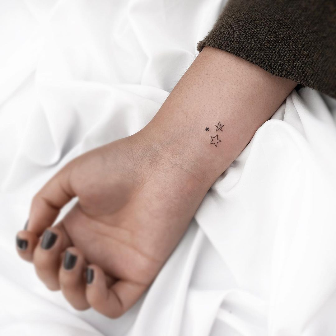 Unique stars tattoo for women, focused constellation design for minimalist style