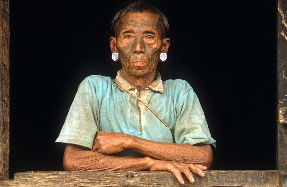 Konyak Naga man with traditional facial tattoos