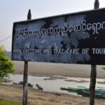 Tourist sign in Khamti, Myanmar, a frontier town leading to Naga lands. The sign marks the gateway to a region rich in cultural traditions, including tattooing.