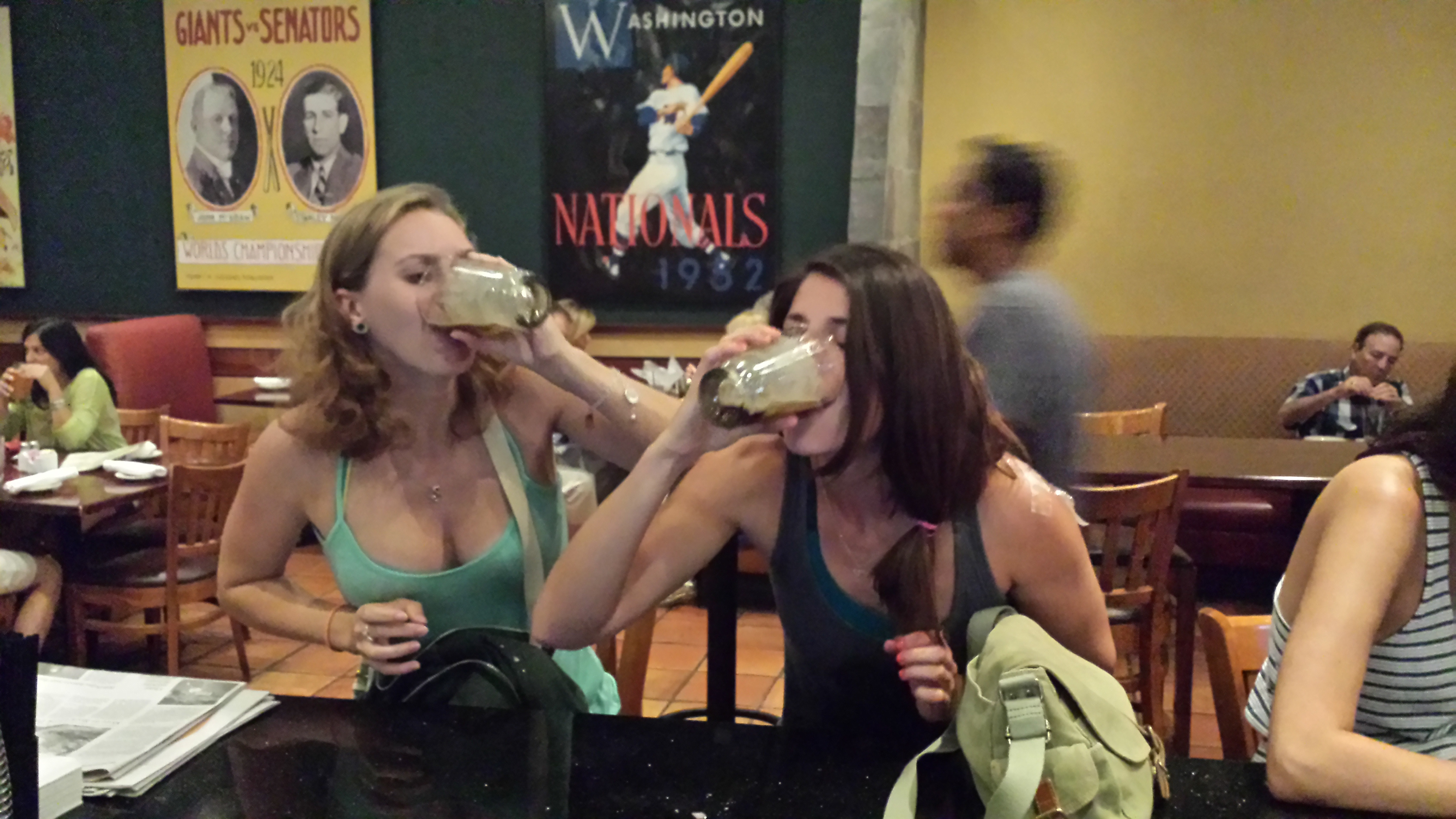 Image of someone chugging an Irish Car Bomb drink quickly, showing the steps to properly consume the cocktail.