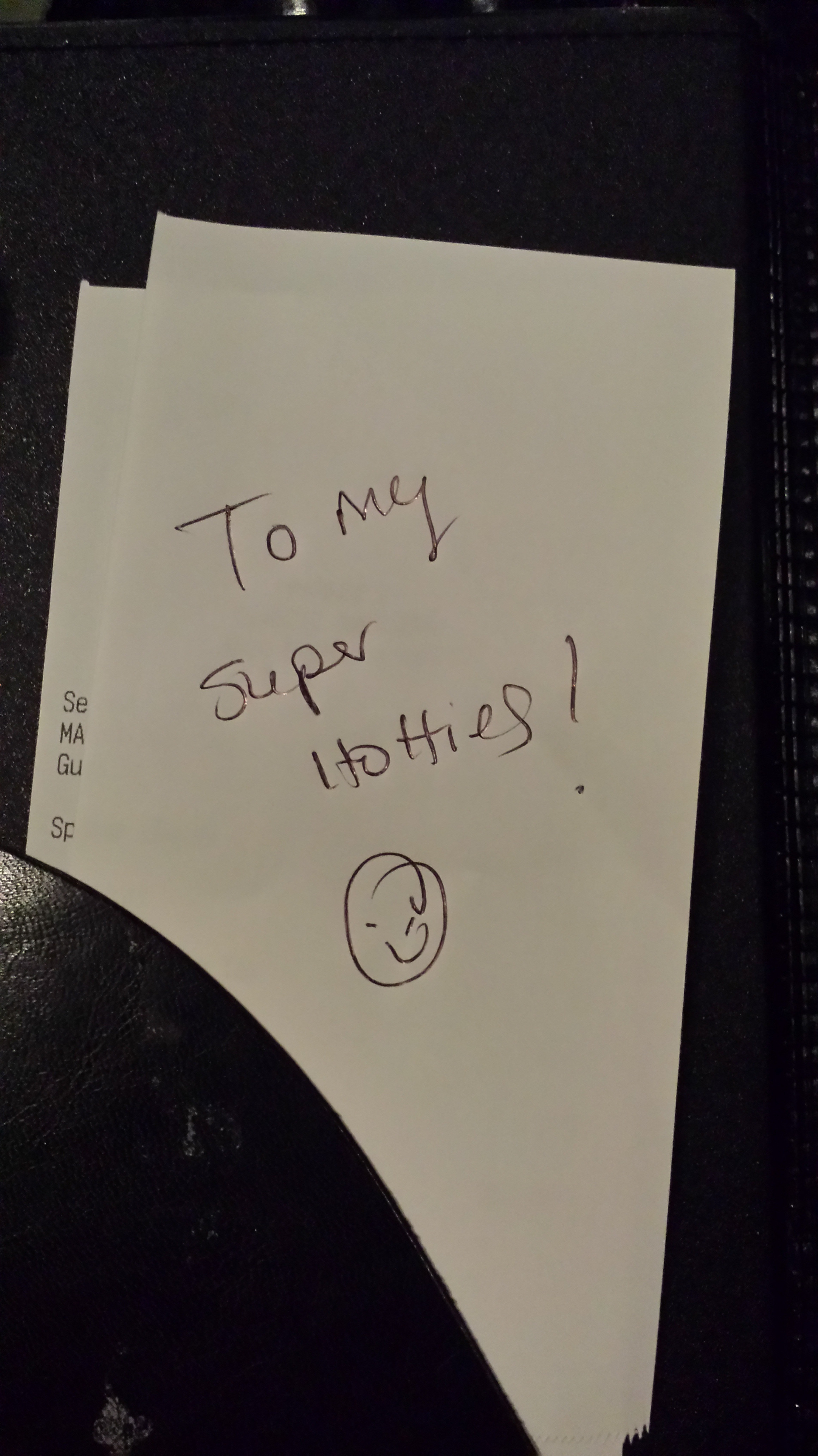 A discounted bar tab with a handwritten love note from the bartender, showcasing the friendly atmosphere of Bethesda nightlife.