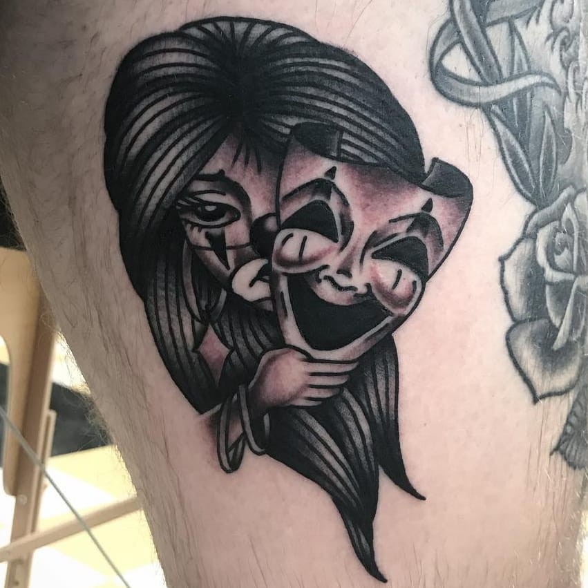 Tattoo by Javier DeLuna. Masked payasa Chicano tattoo by Javier DeLuna in black and grey, highlighting the dramatic and iconic payasa imagery within Javier DeLuna's Chicano tattoo style.