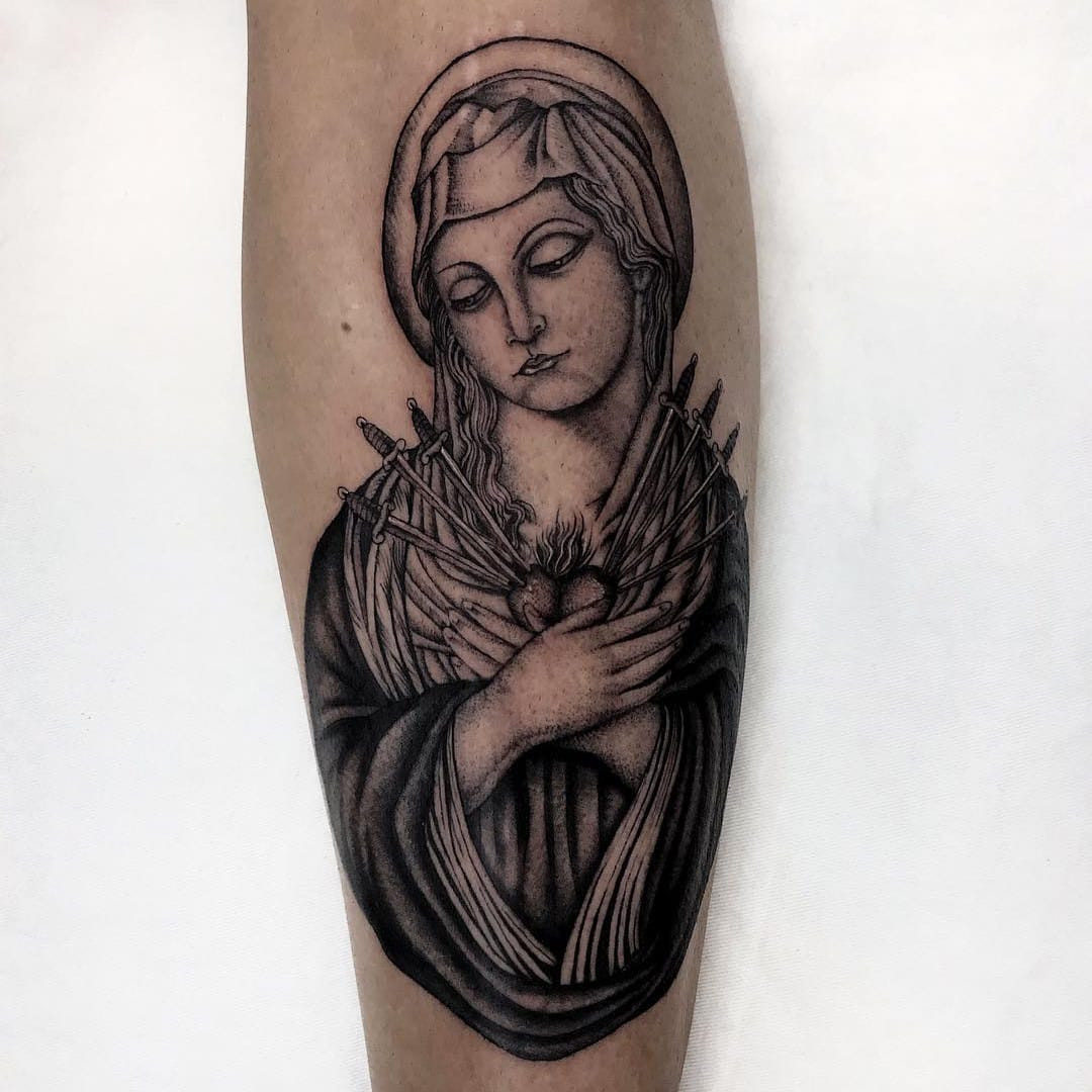 Tattoo by Illegal Tattoos. Religious Chicano tattoo by Illegal Tattoos featuring Juan Diego and the Virgin Mary with sacred heart and swords in black and grey, highlighting the Catholic religious themes within Chicano tattoo art.