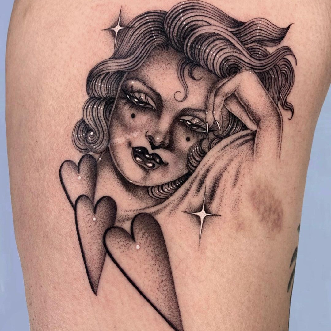 WWII era female pin-up tattoo in a military uniform, symbolizing patriotism and wartime morale.