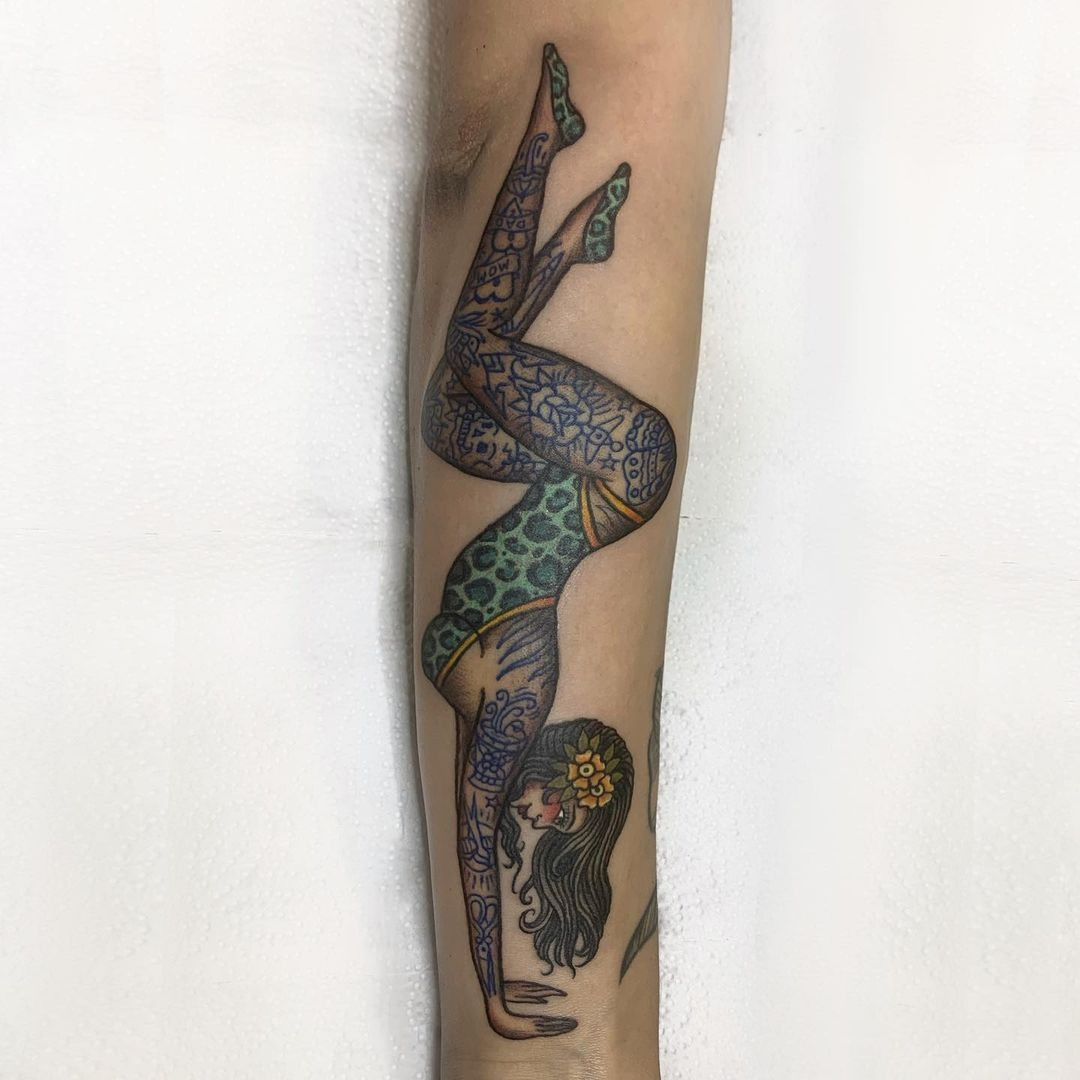 Vintage-inspired female pin-up tattoo showcasing the classic Americana style and enduring appeal.