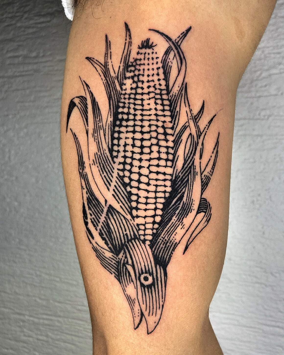 Another tattoo by Kelly Rico, reflecting his belief in not skipping mistakes and learning from the imperfections in chaos tattoo creation.