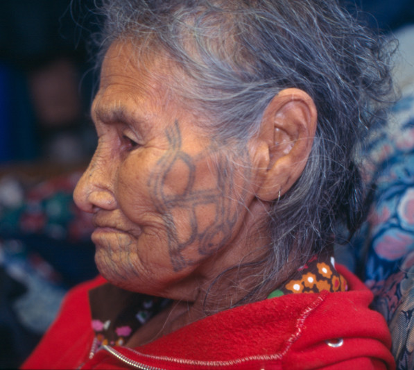 Facial tattoos of Anna Aghtuqaayak of Gambell, St. Lawrence Island, 1997, showcasing traditional designs and their cultural significance.
