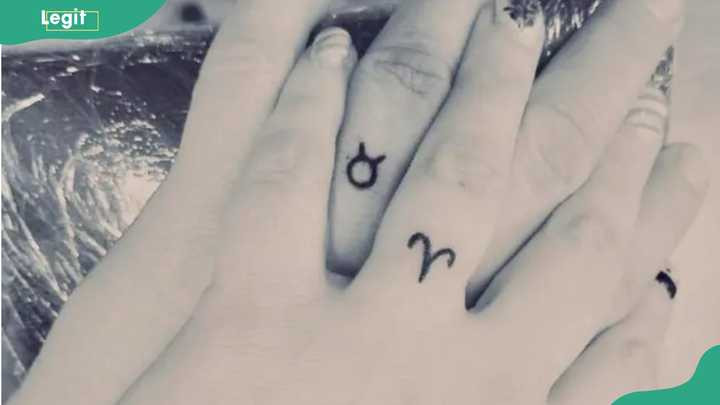Zodiac sign ring tattoo adding a personalized and celestial touch to commitment.
