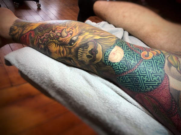 Harmonious color composition in the Kitsune tattoo, showcasing the artist's understanding of color theory