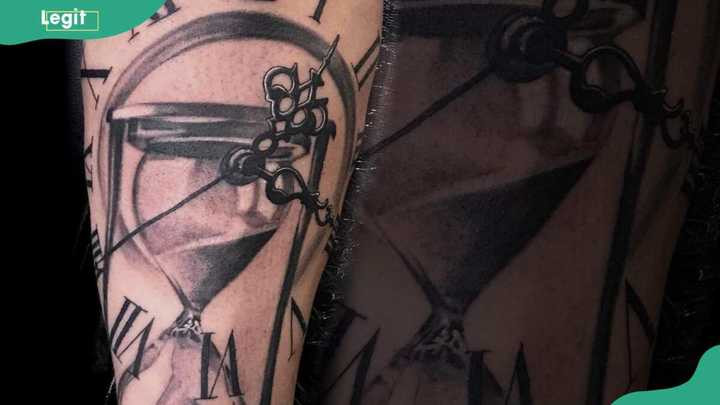 Minimalistic hourglass clock tattoo