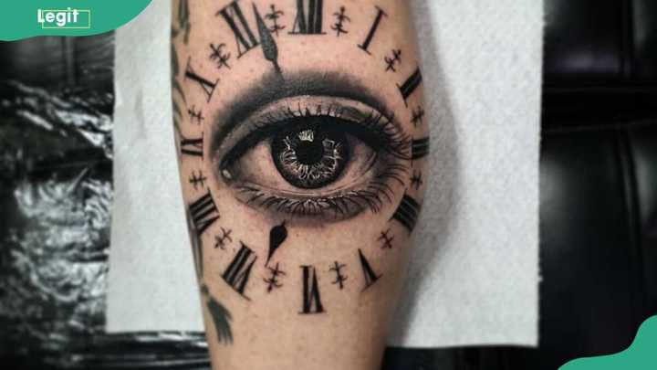 Eye clock tattoo