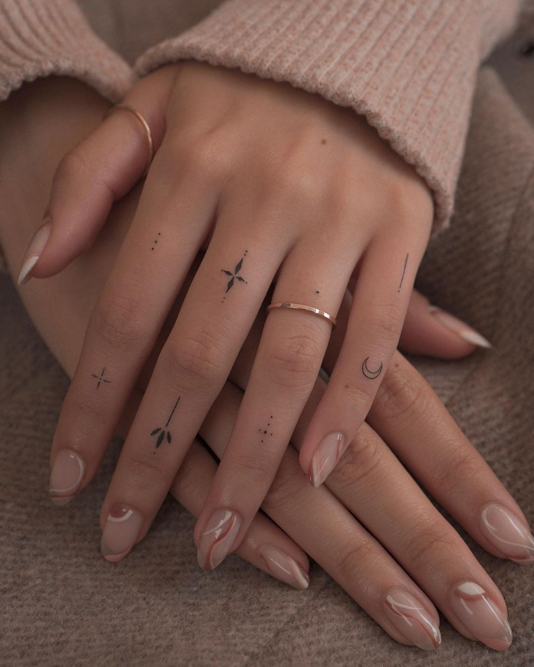 Unique fine line finger tattoo for women, intricate micro-details for a delicate design