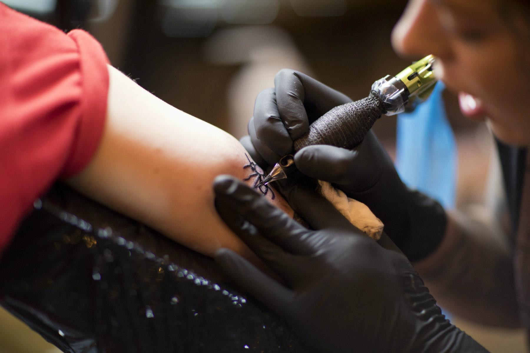 Various bee tattoo designs showcased on different body parts, highlighting the versatility and artistic interpretations of the bee symbol.