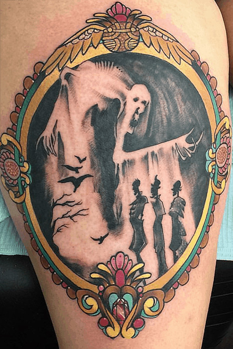 Framed tattoo inspired by &quot;The Tale of the Three Brothers&quot; from Harry Potter, showcasing a story-driven tattoo idea