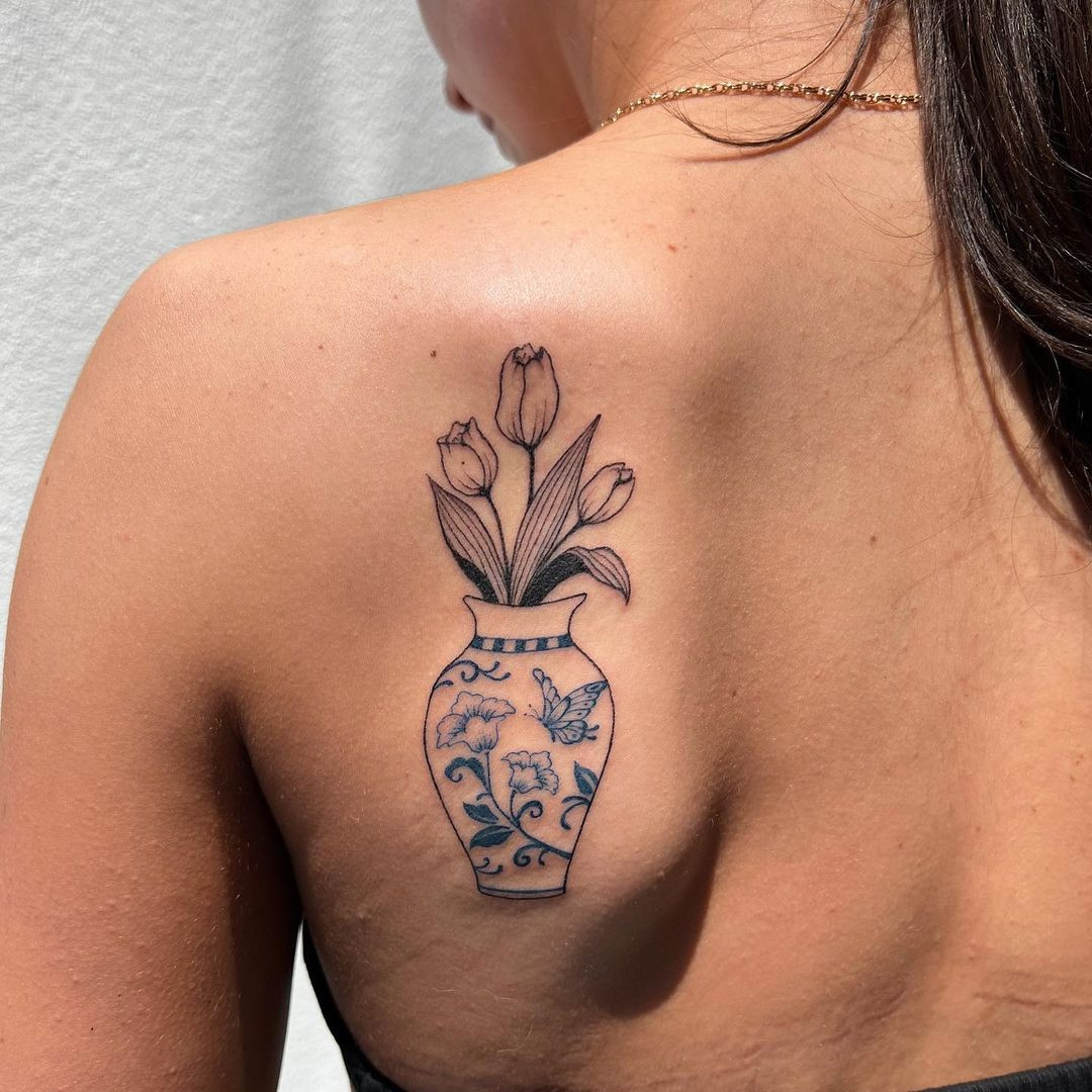 Tulip vase tattoo on forearm, unique and artistic flower pot design