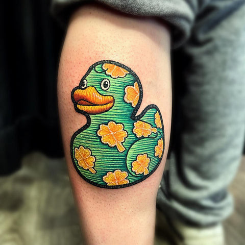 A charming duck embroidered tattoo with detailed feather work