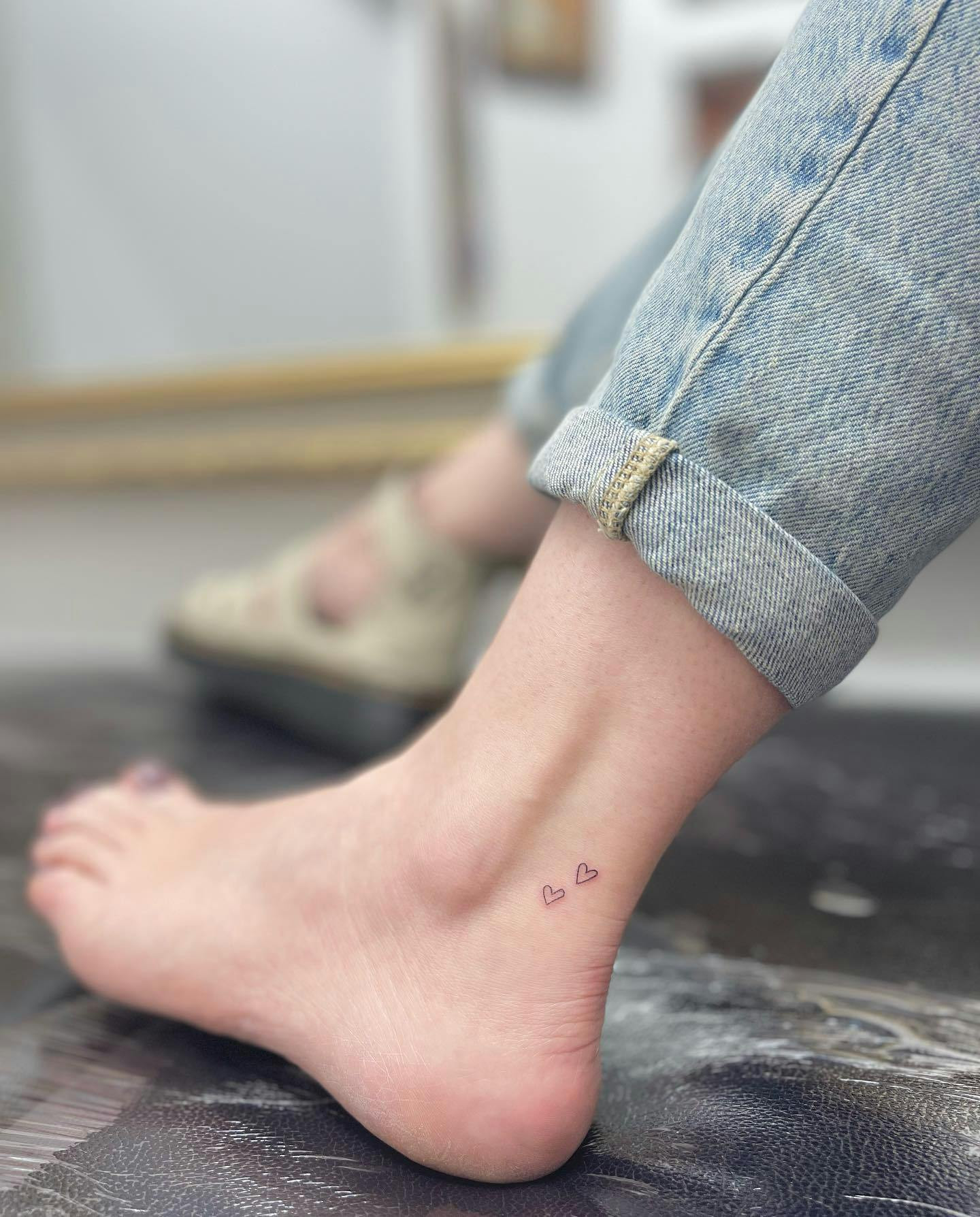 Small heart ankle tattoo for women