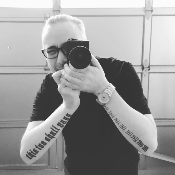Close-up of Clayton Cubitt's &quot;This Too Shall Pass&quot; tattoo on his arm