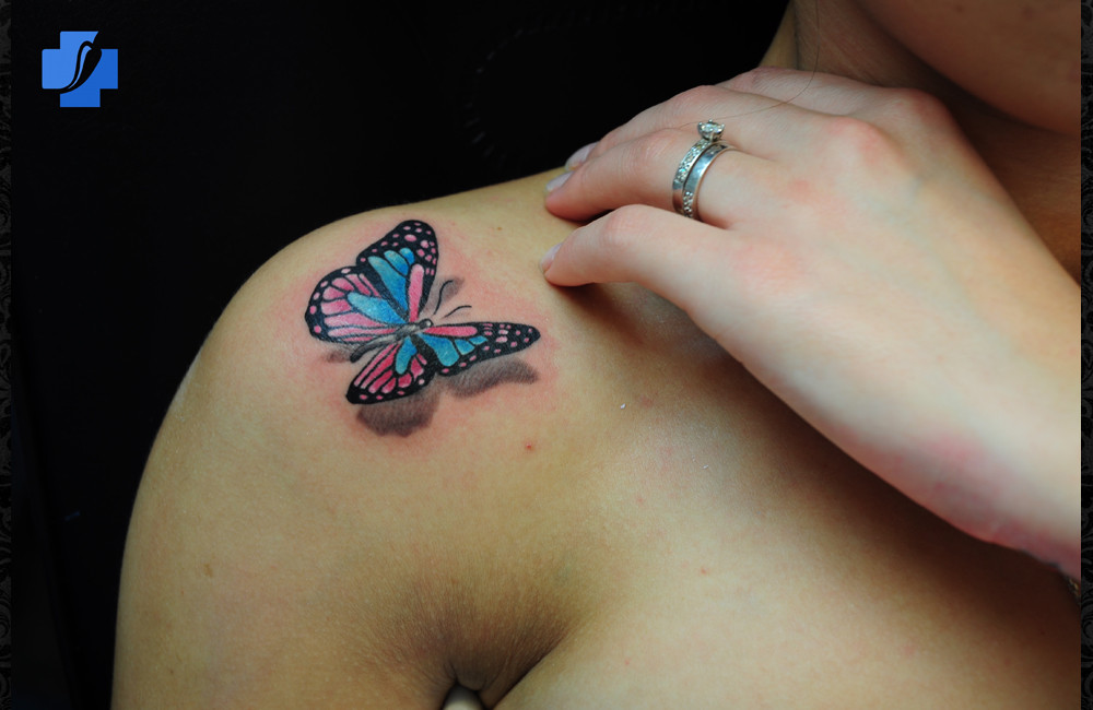 3D butterfly tattoo on shoulder