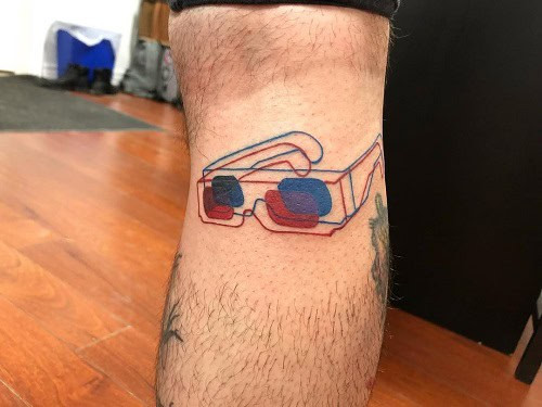 Funky 3D glasses tattoo using red and blue ink for an optical illusion effect.