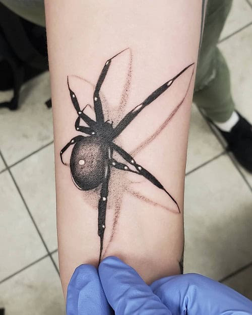 Creepy and realistic 3D spider tattoo, creating an illusion of a spider crawling on skin.