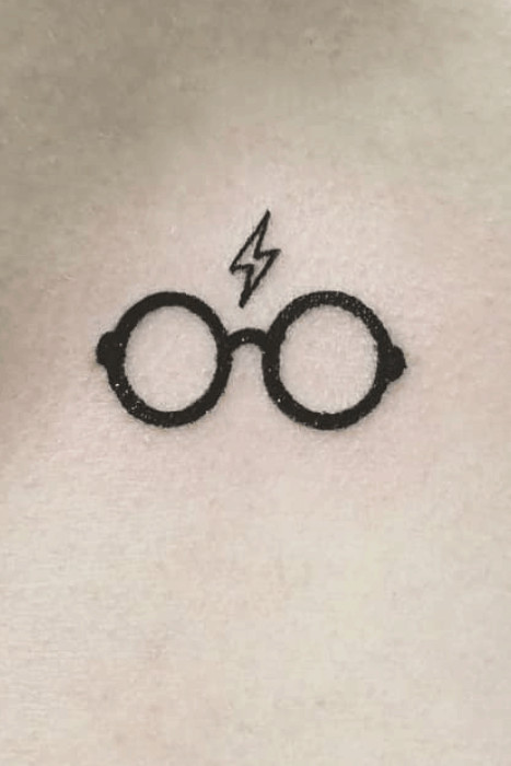 Sweet and simple Harry Potter tattoo of glasses and lightning bolt scar, classic symbols for fans