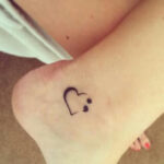 Semicolon tattoo on wrist