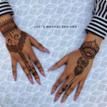 Intricate henna tattoo design on hand, showcasing the beauty of temporary body art.