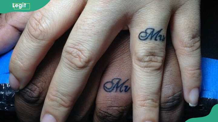Mr. and Mrs. wedding ring tattoos celebrating the union of marriage.