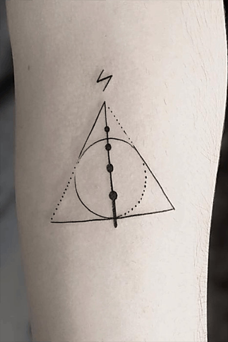 Minimalist Deathly Hallows symbol tattoo, a popular and subtle Harry Potter design choice