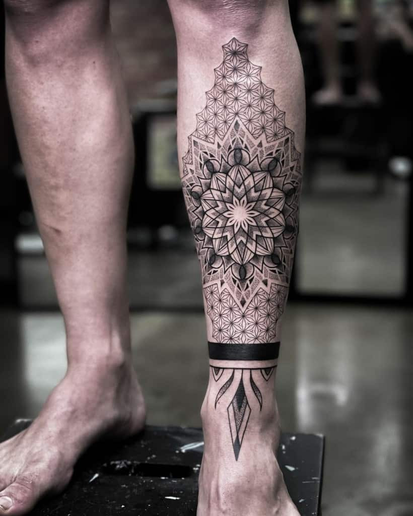 Geometric tattoo with floral pattern on arm