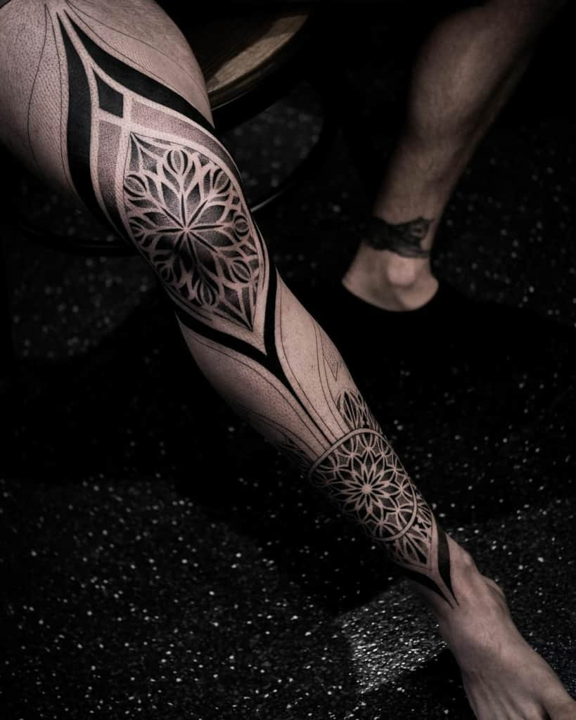 Geometric mandala tattoo on leg