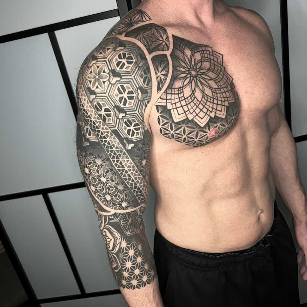 Triangle based sacred geometry tattoo on chest