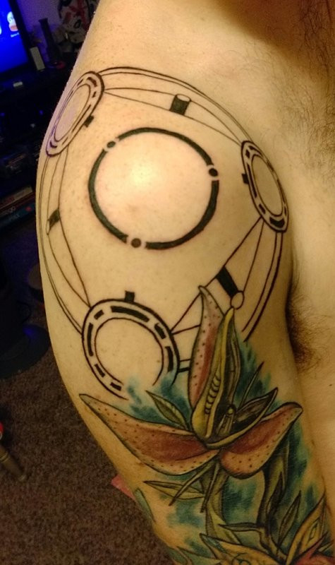 Phantasy Star Online themed tattoo sleeve in progress featuring glyphs and symbols