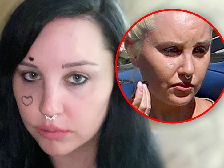 Amanda Bynes heart face tattoo fading